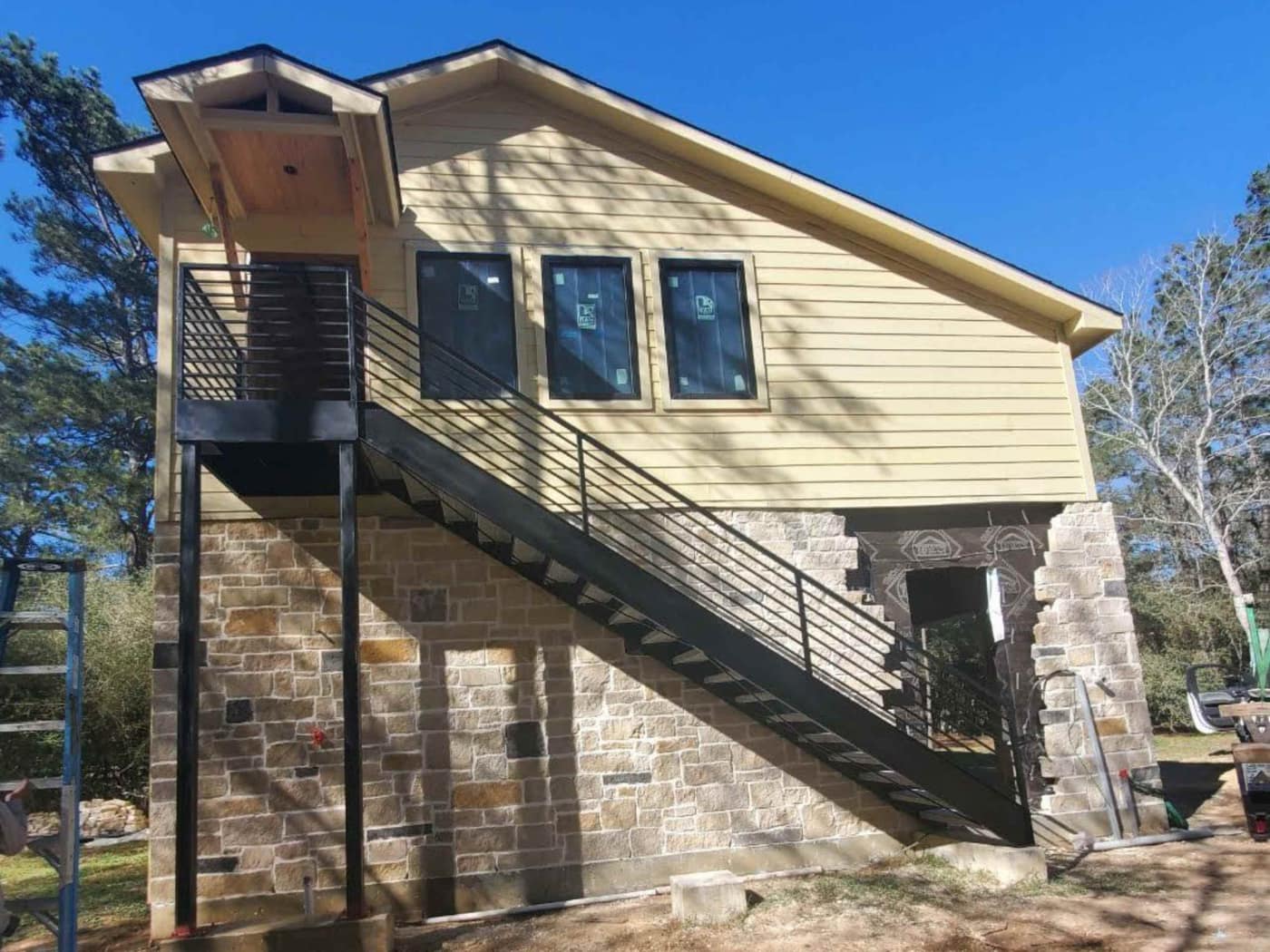 Interior steel stair railings fabricated and installed by Eleven Steel & Wood Services